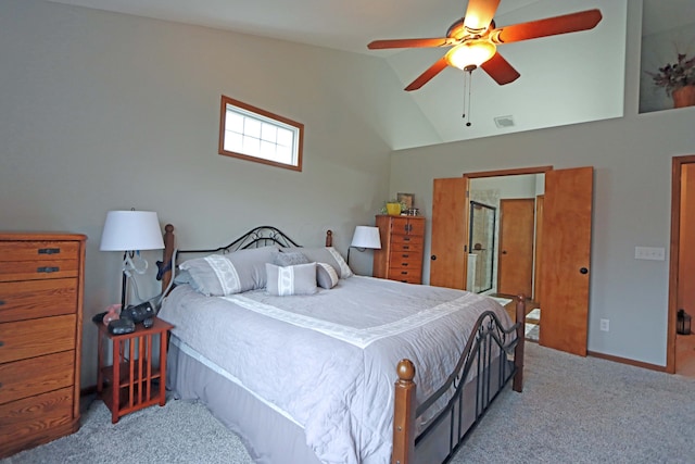 carpeted bedroom featuring lofted ceiling, a ceiling fan, visible vents, and baseboards