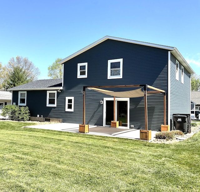 back of house with a yard and a patio area
