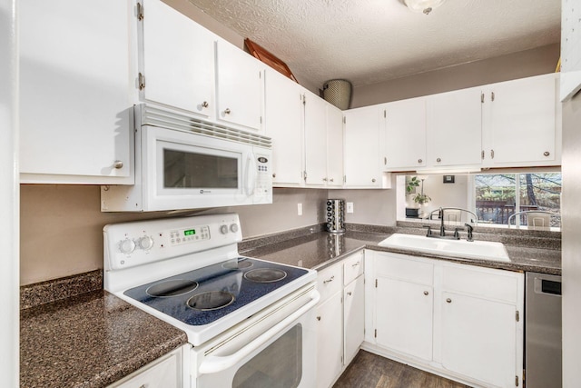 500 Foxtrail Cir E, Westerville, OH 43081 - kitchen featuring a textured ceiling, white appliances, white cabinets, and a sink