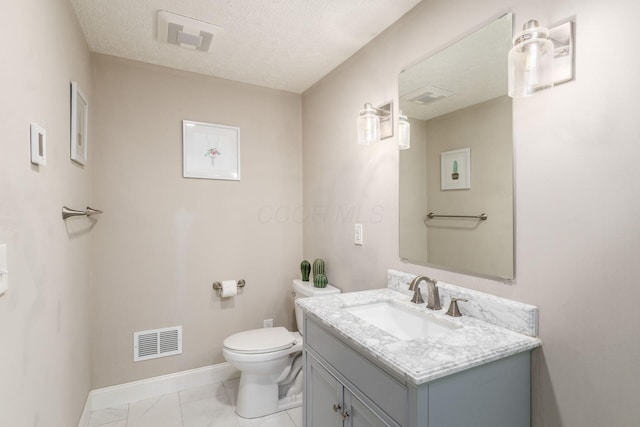 500 Foxtrail Cir E, Westerville, OH 43081 - half bathroom with visible vents, baseboards, toilet, vanity, and a textured ceiling