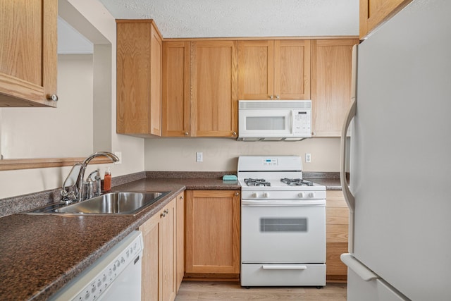 692 Parkbluff Way, Lewis Center, OH 43035 - kitchen with white appliances, dark countertops, and light wood finished floors