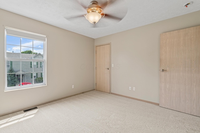692 Parkbluff Way, Lewis Center, OH 43035 - unfurnished bedroom featuring carpet flooring, a ceiling fan, and a textured ceiling