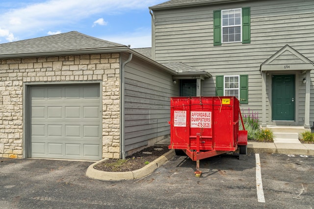 692 Parkbluff Way, Lewis Center, OH 43035 - entrance to property with roof with shingles and stone siding