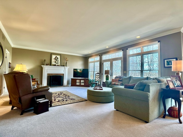 living room with recessed lighting, carpet floors, a fireplace with raised hearth, and ornamental molding
