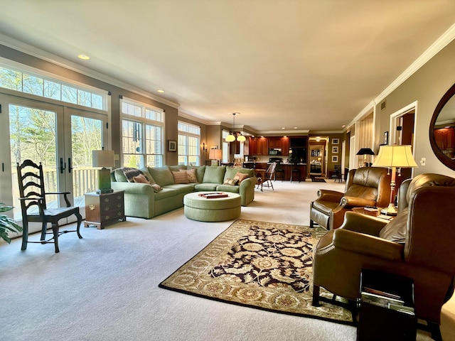 living area featuring recessed lighting, french doors, light colored carpet, and ornamental molding