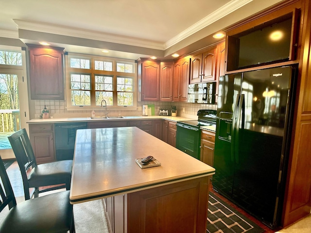 kitchen featuring black appliances, a sink, backsplash, crown molding, and light countertops