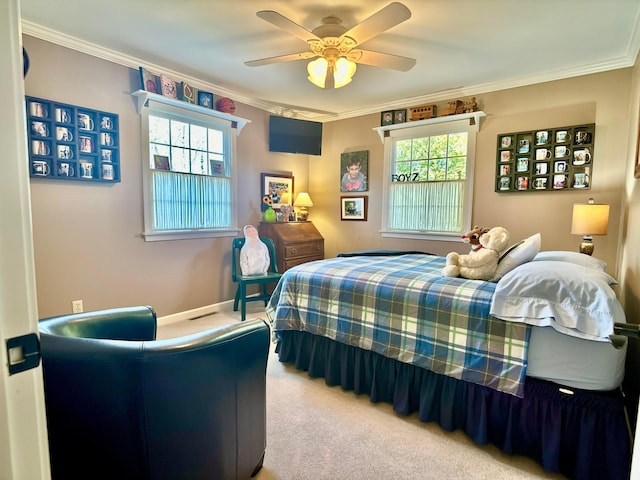 bedroom featuring crown molding, a ceiling fan, baseboards, and light carpet