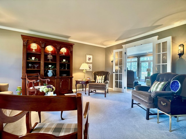 interior space featuring french doors, baseboards, carpet, and ornamental molding