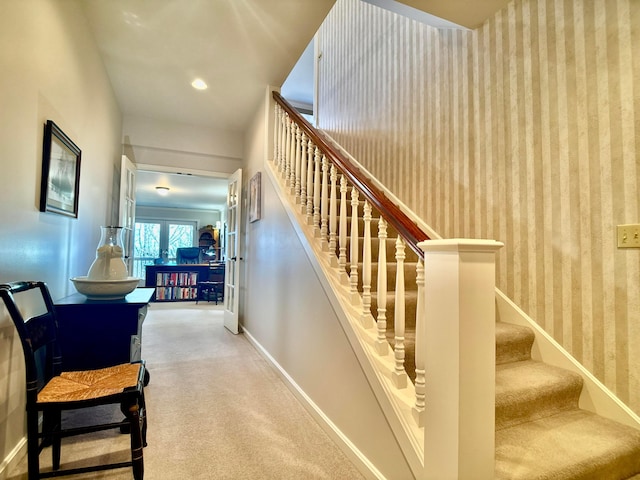 stairs with wallpapered walls, carpet flooring, recessed lighting, and baseboards