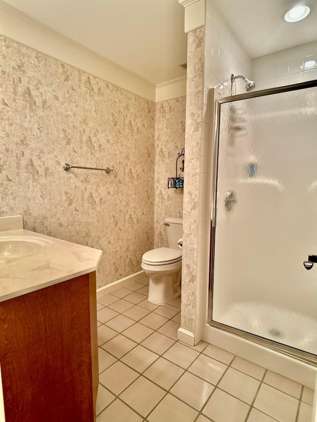 full bathroom featuring tile patterned floors, a shower stall, and vanity