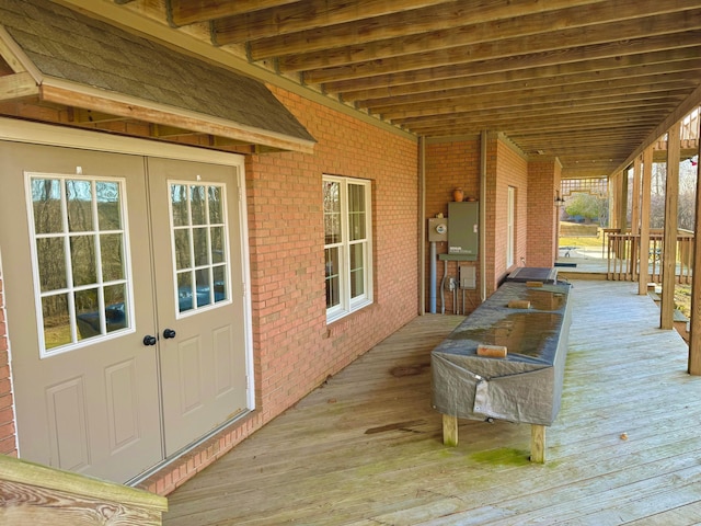 wooden deck featuring french doors