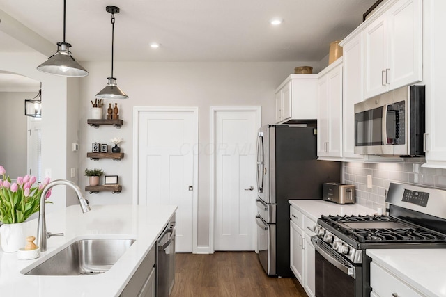 205 Partridge Ct, Pickerington, OH 43147 - kitchen featuring a sink, decorative backsplash, appliances with stainless steel finishes, and light countertops