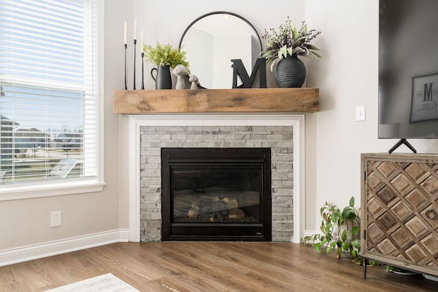 205 Partridge Ct, Pickerington, OH 43147 - details featuring a fireplace, wood finished floors, and baseboards