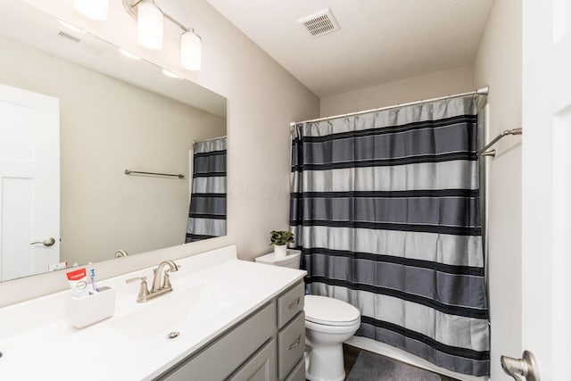 205 Partridge Ct, Pickerington, OH 43147 - bathroom with vanity, a shower with shower curtain, toilet, and visible vents