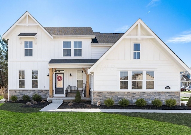 205 Partridge Ct, Pickerington, OH 43147 - modern inspired farmhouse with a porch, stone siding, board and batten siding, and a front yard
