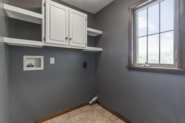 laundry room featuring cabinet space, baseboards, electric dryer hookup, and hookup for a washing machine