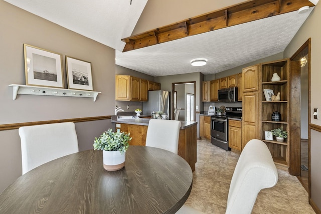 dining area with a textured ceiling