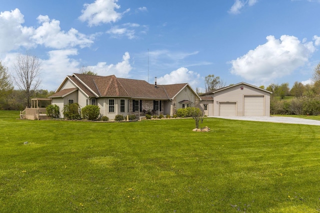 ranch-style home featuring a detached garage, an outdoor structure, and a front yard
