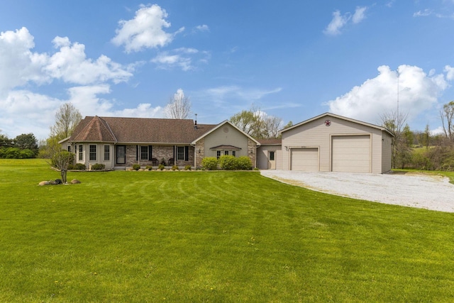 ranch-style house featuring a garage and a front yard