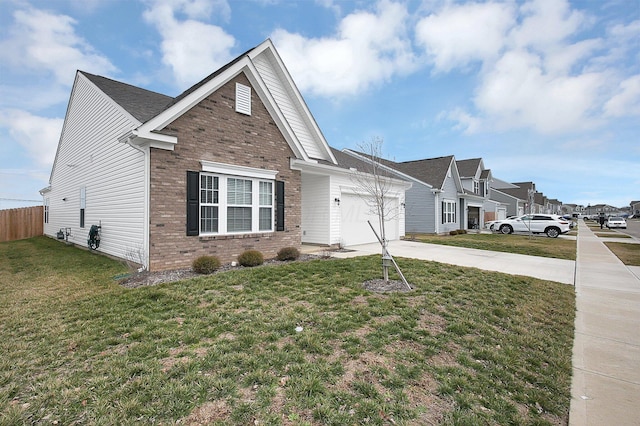 view of front facade featuring a garage, driveway, brick siding, and a front yard