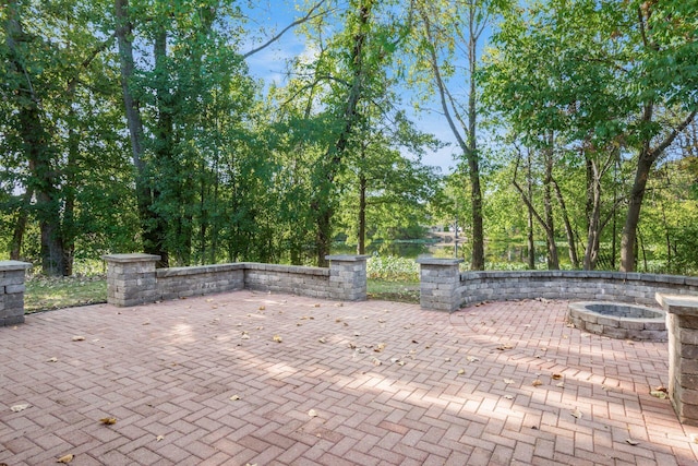 view of patio with a fire pit