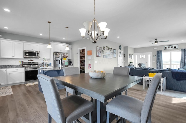 14690 S Perry Rd, Laurelville, OH 43135 - dining area with recessed lighting, dark wood finished floors, and ceiling fan with notable chandelier