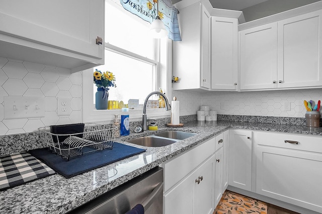 14690 S Perry Rd, Laurelville, OH 43135 - kitchen with light stone counters, a sink, decorative backsplash, white cabinets, and stainless steel dishwasher
