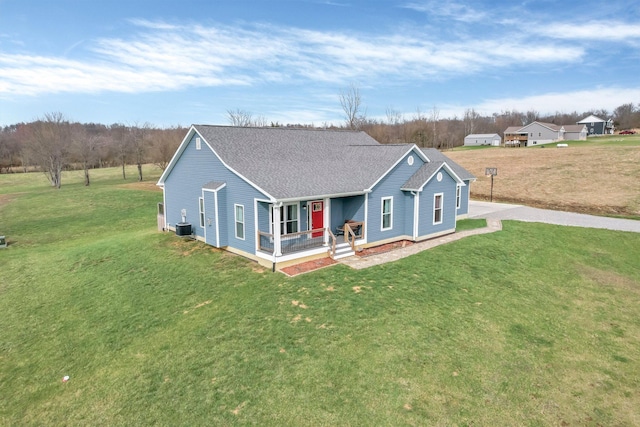 14690 S Perry Rd, Laurelville, OH 43135 - view of front of property with central air condition unit, covered porch, a front lawn, and a shingled roof