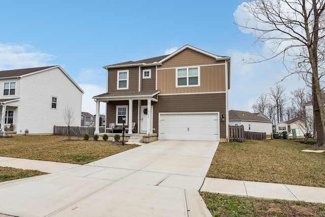 268 Aaron Dr, Delaware, OH 43015 - view of front of home featuring fence, driveway, a front lawn, a porch, and a garage