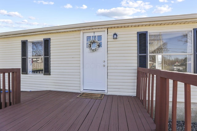 property entrance with a wooden deck