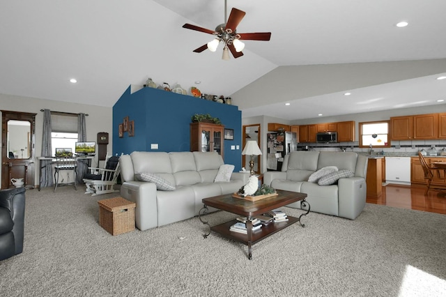 living room with a ceiling fan, light carpet, vaulted ceiling, and recessed lighting