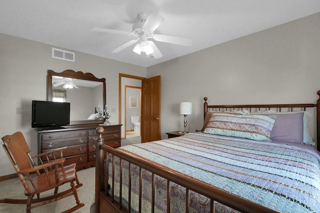 carpeted bedroom featuring visible vents and a ceiling fan