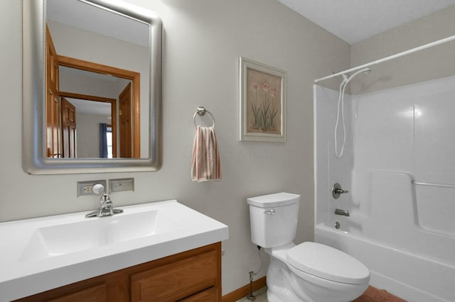 bathroom with toilet, vanity, and bathing tub / shower combination