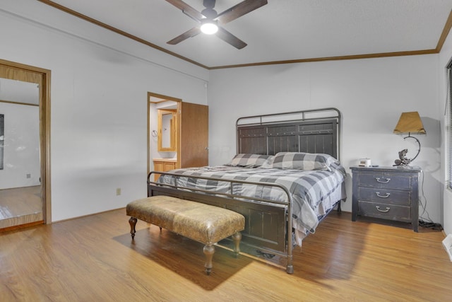 bedroom with ceiling fan, wood finished floors, and crown molding
