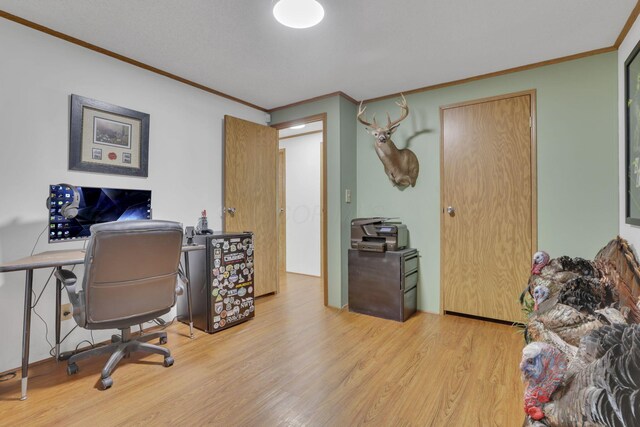 office area with crown molding and wood finished floors