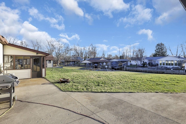 view of yard featuring a residential view and a sunroom