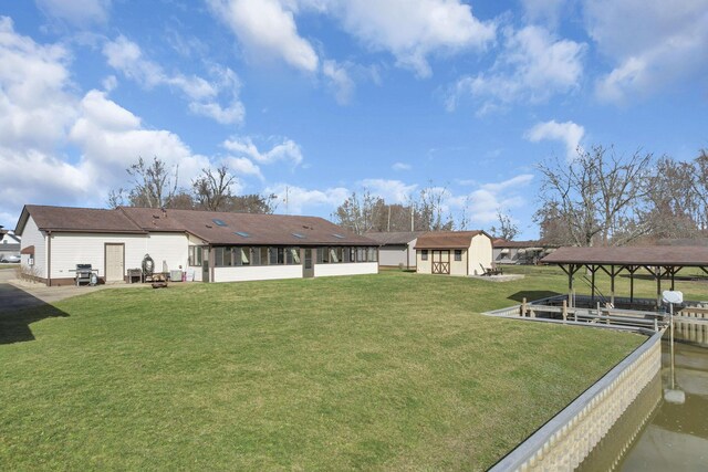 view of yard featuring a sunroom