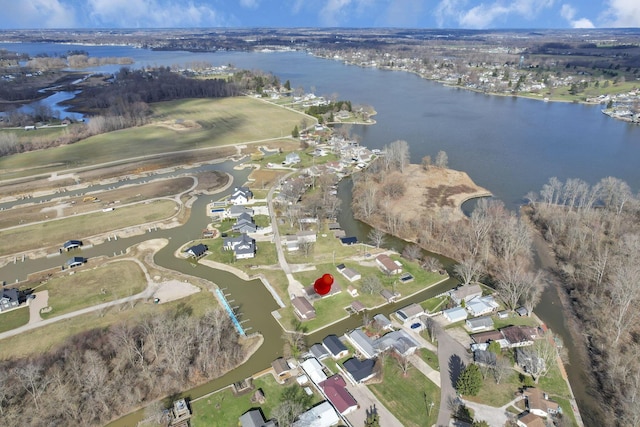 drone / aerial view featuring a residential view and a water view