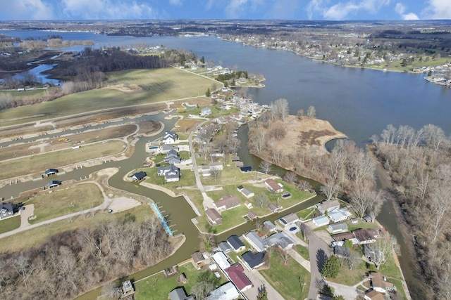 bird's eye view featuring a water view and a residential view