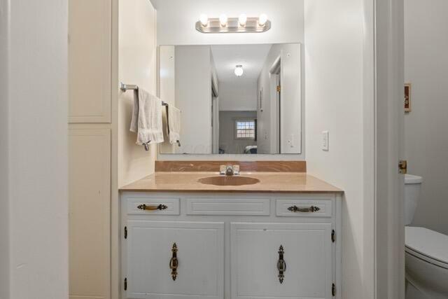 bathroom featuring vanity and toilet