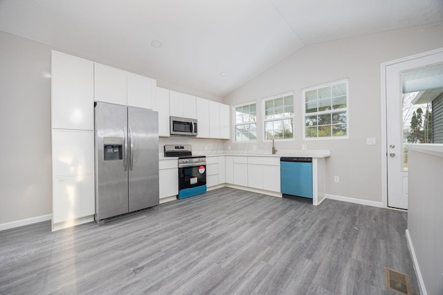 1651 Hillcrest Ave, Obetz, OH 43207 - kitchen with white cabinetry, plenty of natural light, light wood finished floors, and stainless steel appliances