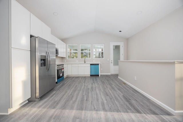1651 Hillcrest Ave, Obetz, OH 43207 - kitchen featuring white cabinets, appliances with stainless steel finishes, light countertops, and a sink