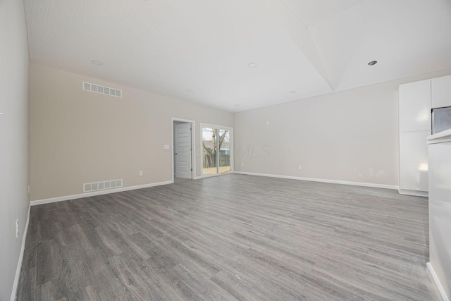 1651 Hillcrest Ave, Obetz, OH 43207 - unfurnished living room with visible vents, baseboards, and wood finished floors
