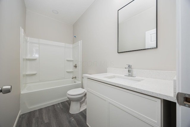 1651 Hillcrest Ave, Obetz, OH 43207 - full bathroom with vanity, toilet, wood finished floors, and tub / shower combination