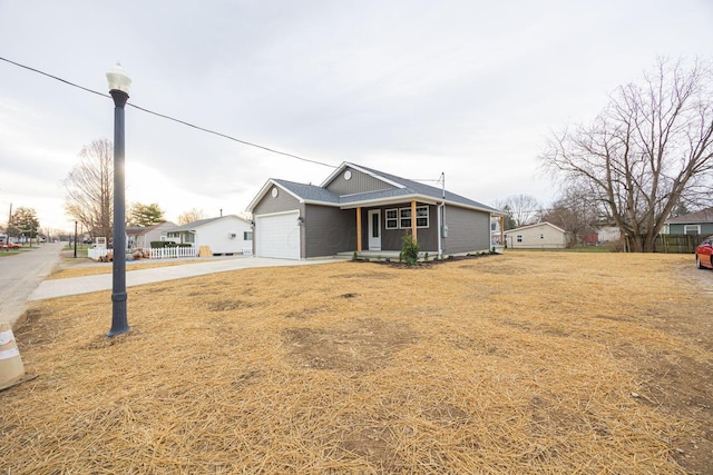 1651 Hillcrest Ave, Obetz, OH 43207 - single story home featuring a front lawn, concrete driveway, a garage, and fence