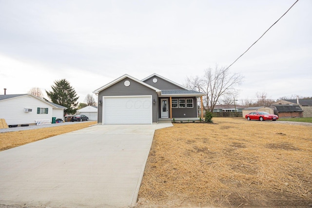 1651 Hillcrest Ave, Obetz, OH 43207 - view of front of house with driveway, an attached garage, and a front lawn