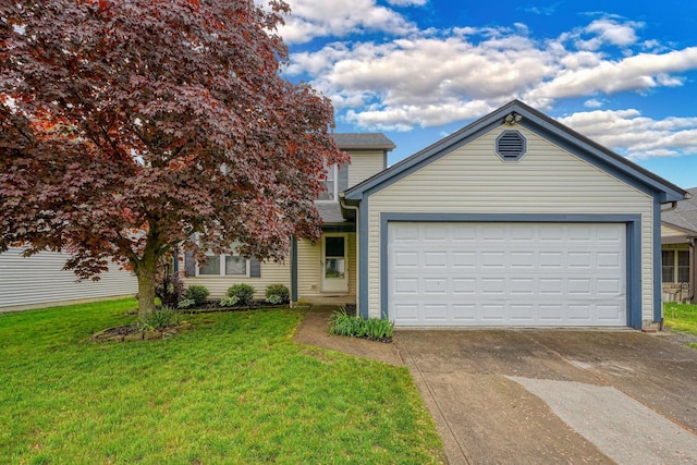 view of front of property with an attached garage, driveway, and a front yard