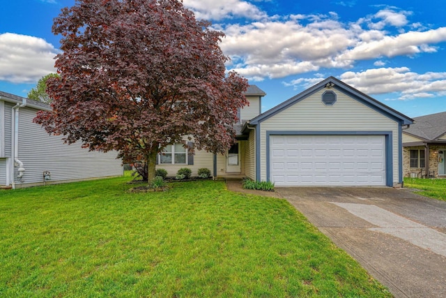 view of front facade featuring an attached garage, concrete driveway, and a front yard
