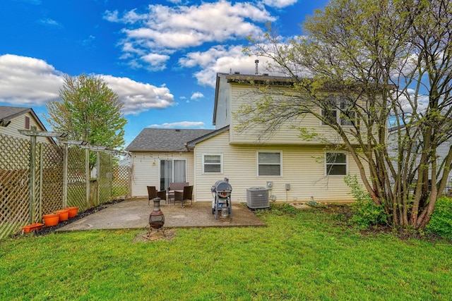 back of house featuring central AC, a pergola, fence, a patio, and a yard