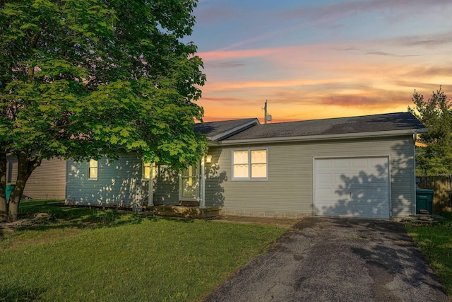 145 Danbury Rd, West Jefferson, OH 43162 - view of front of house with a garage, driveway, and a front lawn